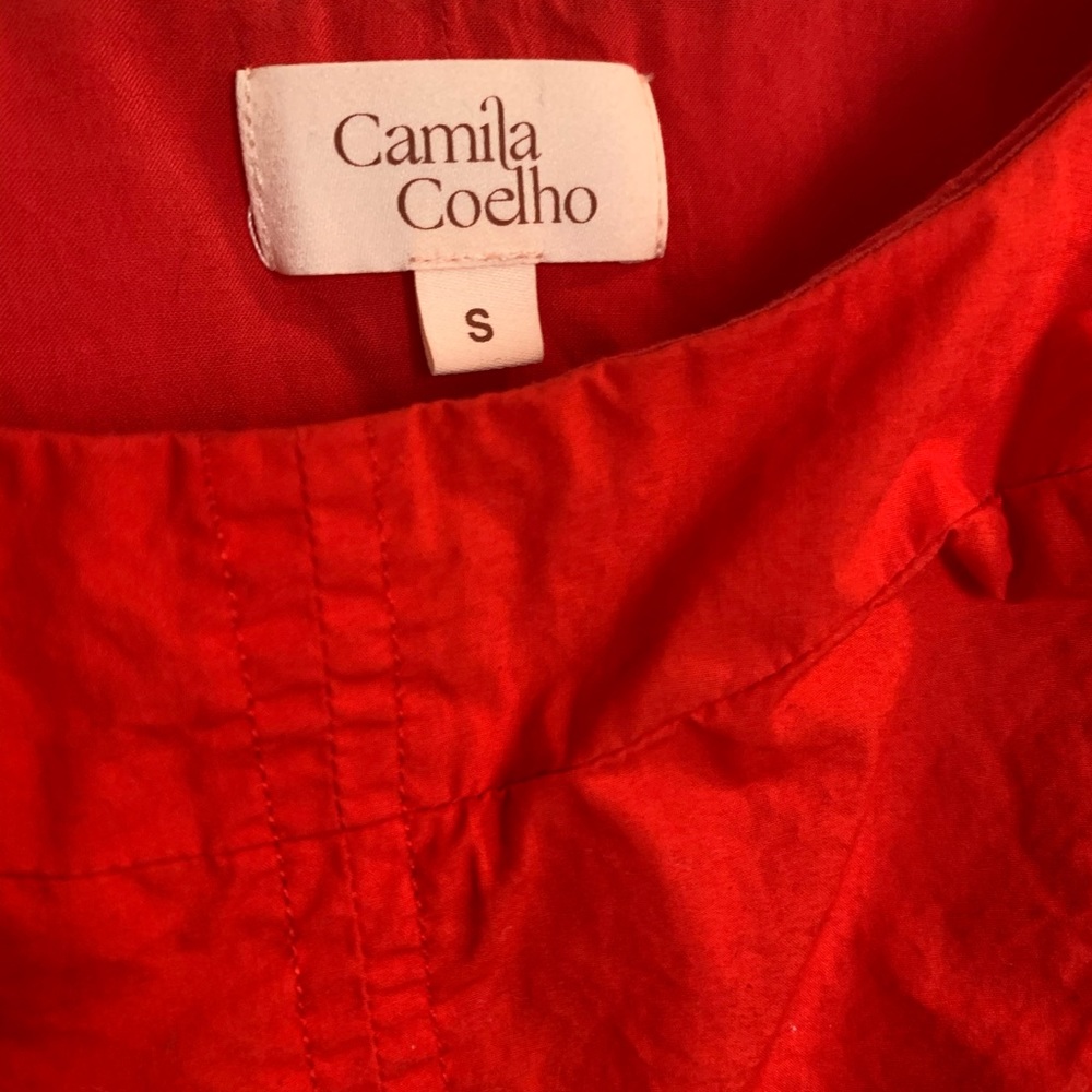 Red crop top with puff sleeves and wide neck